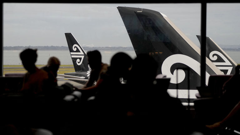 Passengers wait in the Air New Zealand lounge at Auckland International Airport in Auckland, New Zealand, Wednesday, March 23, 2022.