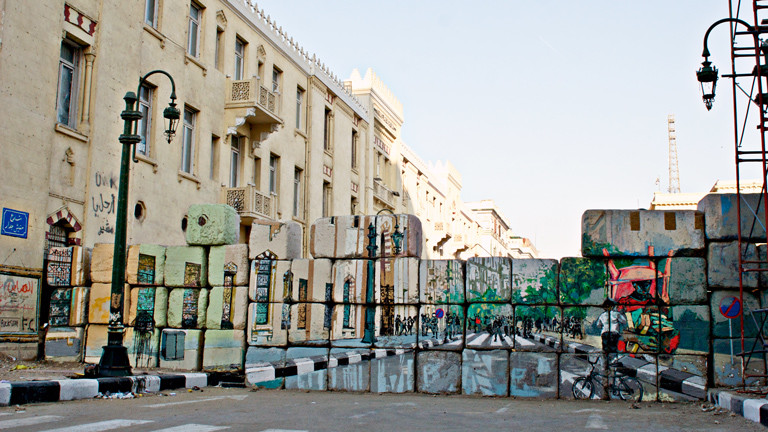 The “No Walls” campaign is an attempt by artists to create a tromp l’oeil effect on barrier walls constructed by the military to impede protesters.