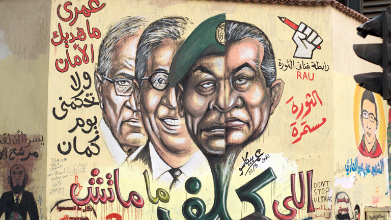 A mural showing Tantawy/Mubarak and two presidential candidates that served during Mubarak Era.