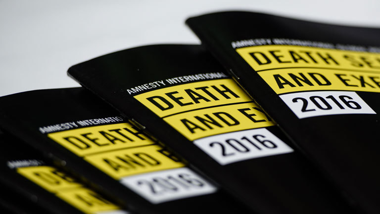 In this photo taken on April 10, 2017, global report booklets by Amnesty International entitled 'Death Sentence and Execution' are displayed on a table during a media briefing by Amnesty International at the Foreign Correspondents' Club (FCC) in Hong Kong. China executed more people in 2016 than all other nations combined, Amnesty International said on April 11, 2017, as death penalties in the world decreased overall.