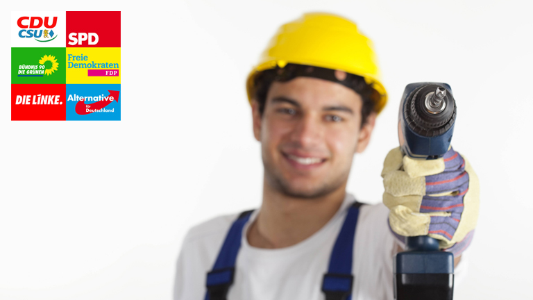 Bauarbeiter mit Bohrmaschine