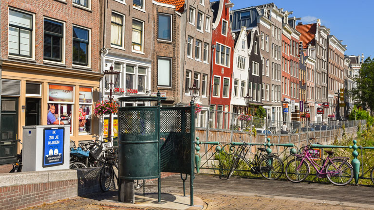 Amsterdam, Netherlands. August 2022: An original public urinal at the Waagplein.