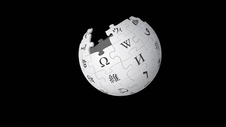 Das Wikipedia-Logo vor schwarzem Hintergrund